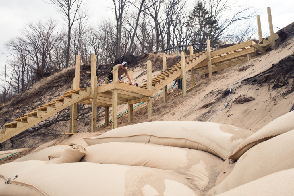 Wooden Staircase on dune with geotextile tubes